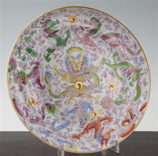 A Chinese famille rose seven dragons plate, 19th century, 24.8cm